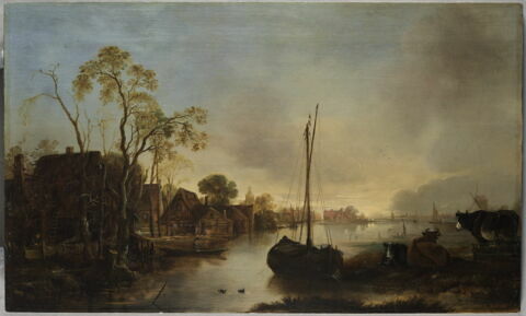 Maisons et vaches au bord de l’eau
