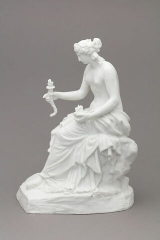 Statuette
Biscuit de porcelaine
 représentant une femme tenant un flambeau d'une main et une coupe de l'autre
Titre gravé : Message