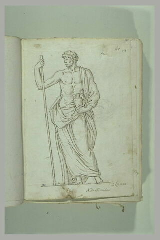 Homme debout, vu de face, le bras droit appuyé sur un long bâton, ..., image 2/2