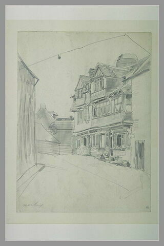 Rue à Morlaix, avec une femme assise devant une maison, image 1/1