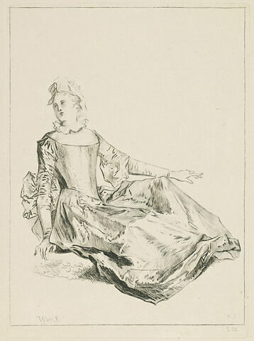 Jeune femme assise par terre